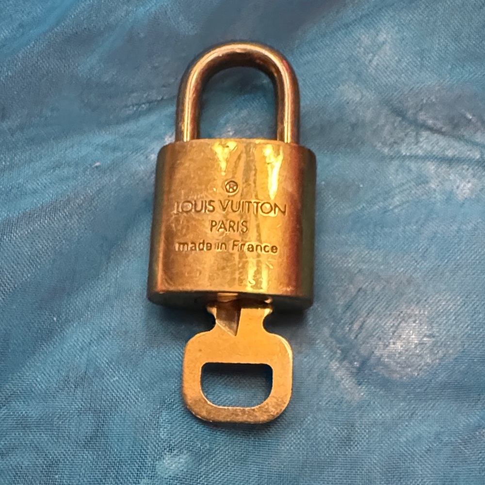 Louis Vuitton gold-tone brass padlock and key set #303